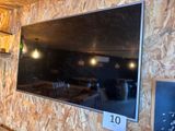 a large flat screen tv hanging on the wall