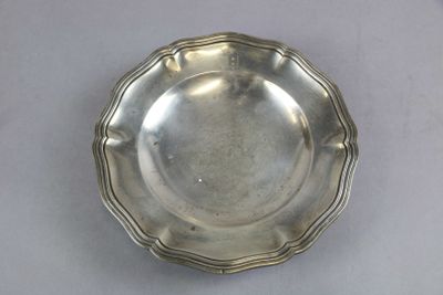 a silver plate on a table with a white table cloth