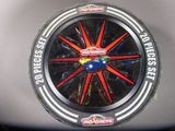a close up of a toy car wheel on a table