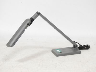 a desk lamp that is sitting on a table