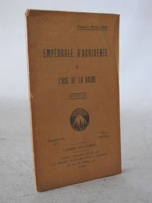 a brown book sitting on a table with a white background