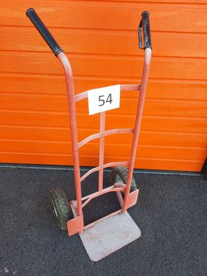 an orange hand truck with a number 54 on the front