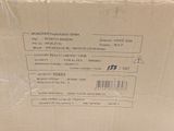 packaging of a box with a price label on it sitting on a table