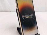 a phone that is sitting on a stand on a table