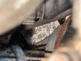 a close up of a metal object in the dirt