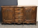 an old wooden dresser with drawers and drawers on top of it