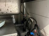 an image of a kitchen with a sink and a fire extinguisher