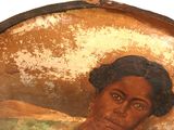 a painting of a woman in a green dress on the wall