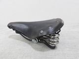 a black bicycle seat with springs attached to it