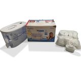 a box of toilet paper and a tissue dispenser next to it