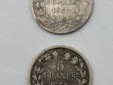three coins are shown on a white surface with a white background