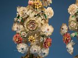 two vases that have flowers in them on a table