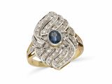gros plan d'une bague en diamant et saphir sur fond blanc