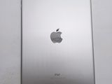 the back of an ipad with a silver apple logo on it