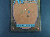 the back cover of a card game with a picture of a circle on it