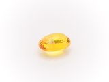 a yellow sapphire stone on a white background