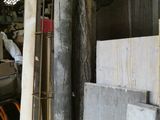a large pile of concrete blocks in a warehouse