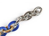 a close up of a chain on a white surface