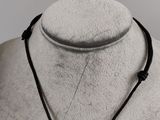 black leather necklace with three beads on a mannequin neck