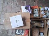 many boxes of assorted items sitting on the ground