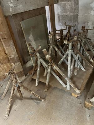 a lot of old tools that are sitting on the floor