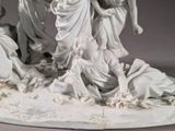 a statue of a group of people on a table