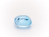 an oval blue topaze gems on a white background