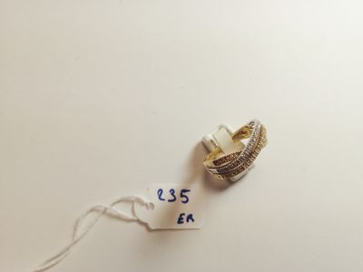 a small piece of jewelry that is on a table