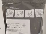 a bag of face masks sitting on a table