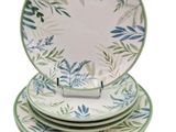 three green and white plates stacked on top of each other
