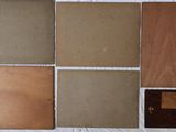 several pieces of brown paper are laid out on a white sheet