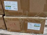 boxes on a pallet in a warehouse are stacked on top of each other