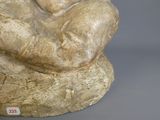 a statue of a woman holding a baby in her arms