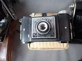 an old camera that is sitting on top of a box