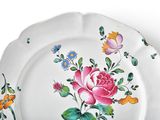 a white plate with a floral design on it