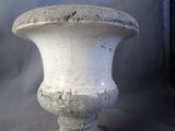 a white vase that is sitting on a table