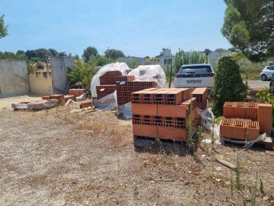 a lot of crates that are sitting in the dirt
