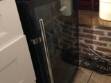 an image of a kitchen with a sink and a refrigerator