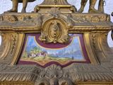 a statue of an elephant on top of a clock