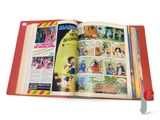 an open book with a picture of a comic strip