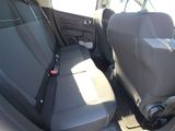 two seats in the back of a car with a seat belt