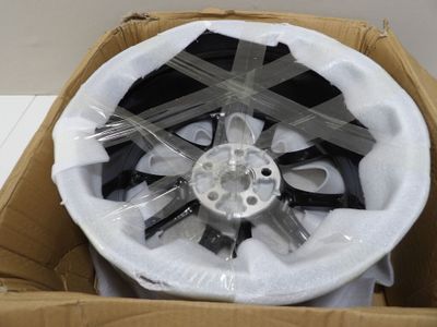 a box with a fan inside of it on the floor