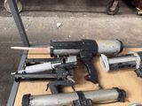 many different types of nail guns on a table