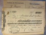 an old document with writing on it sitting on a table