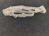 silver plated tie bar on a chain with a clasp