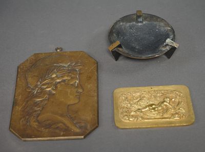 three gold and silver items including a cigarette case, a cigarette holder, and a lighter