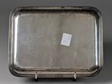 a silver tray that has a tag on it