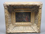 an old picture frame with a painting of a man and a woman playing cards