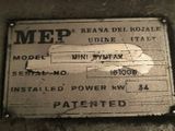 an old metal sign that is on the side of a wall