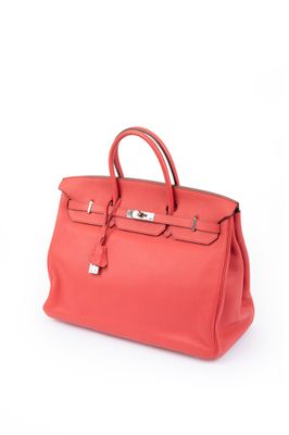 a red leather handbag on a white background